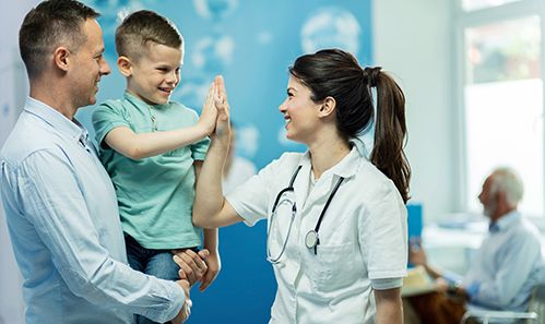 young male patient giving the doctor a high five